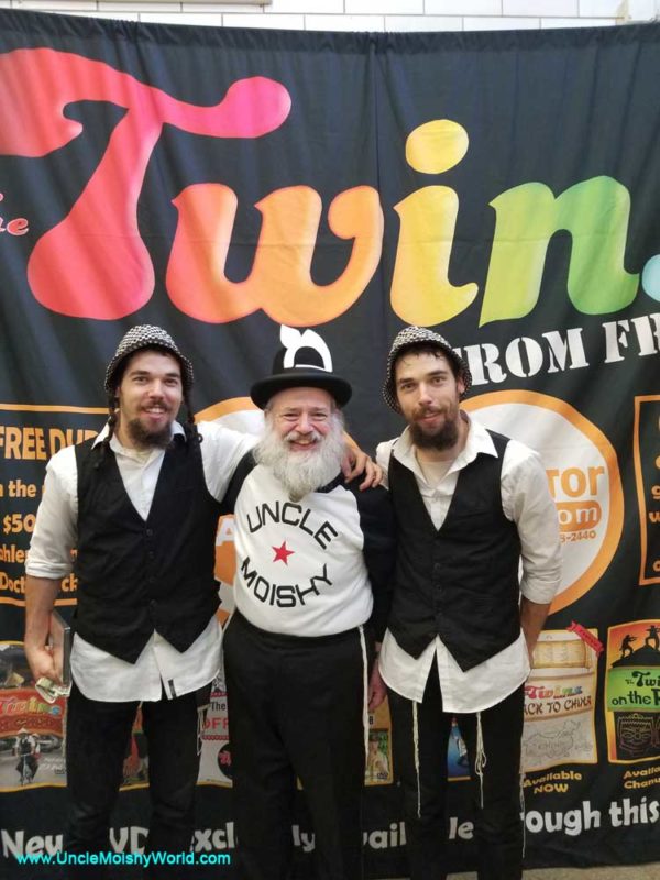The original Uncle Moishy posing with group members at the Tafkid Family Purim Festival.