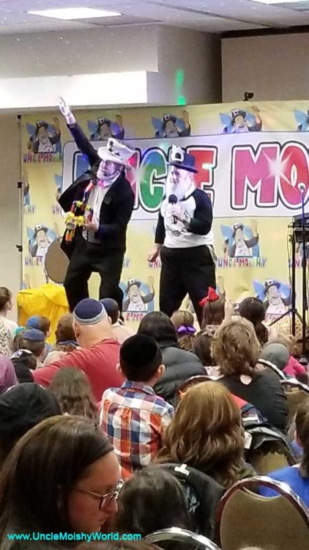 Uncle Moishy and other Jewish children entertainers on stage at the Woodmere Pesach.