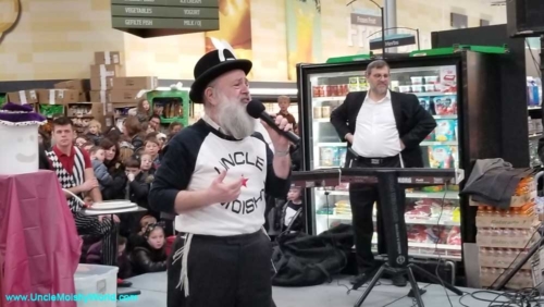 Moishy Tanenbaum, the original Uncle Moishy singing at the Gourmet Glatt in Lakewood.